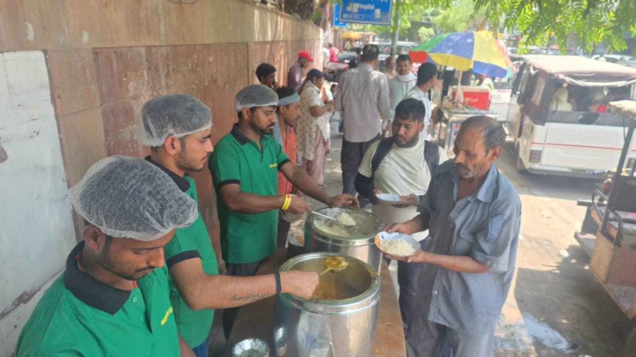 Volunteers and an Al Ranim Properties partner at a community meal distribution in India