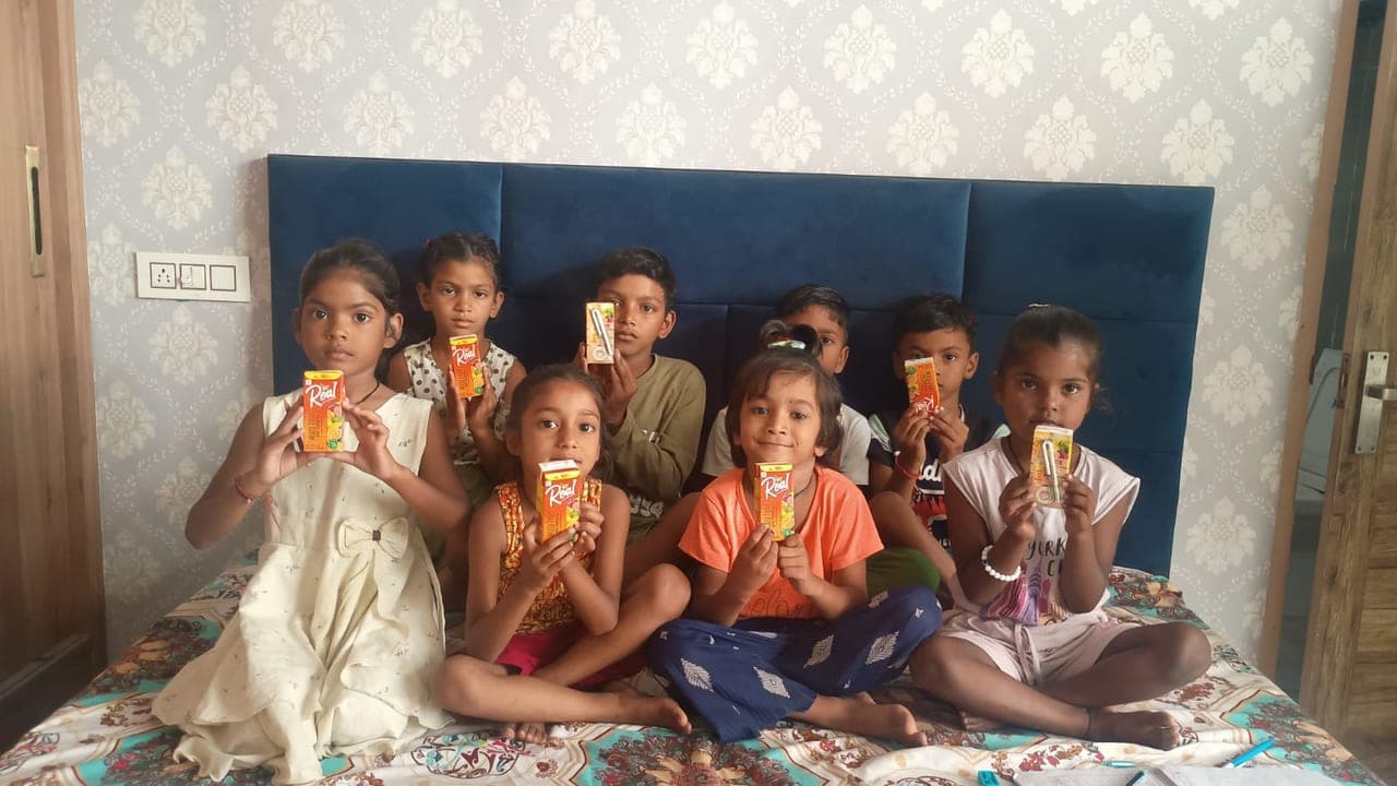 Children supported by Al Ranim Properties education sponsorship in India with refreshments